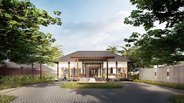 Pavillon de réception de l'hotel et cour pavée bordée d'arbres